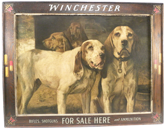 Winchester cardboard sign depicting bear dogs, housed in its rare and original wood frame. Image courtesy of Showtime Auction Services.